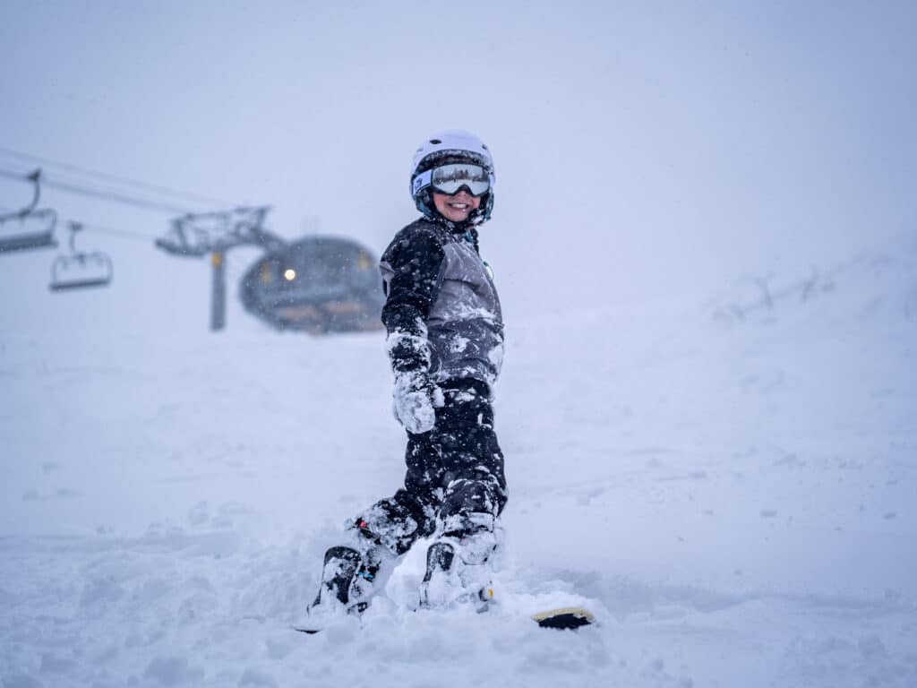 Kid skier at Nordic Valley by the Nordic Express 6 pack ski lift